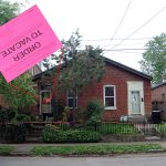 Partial wall collapse at shotgun house