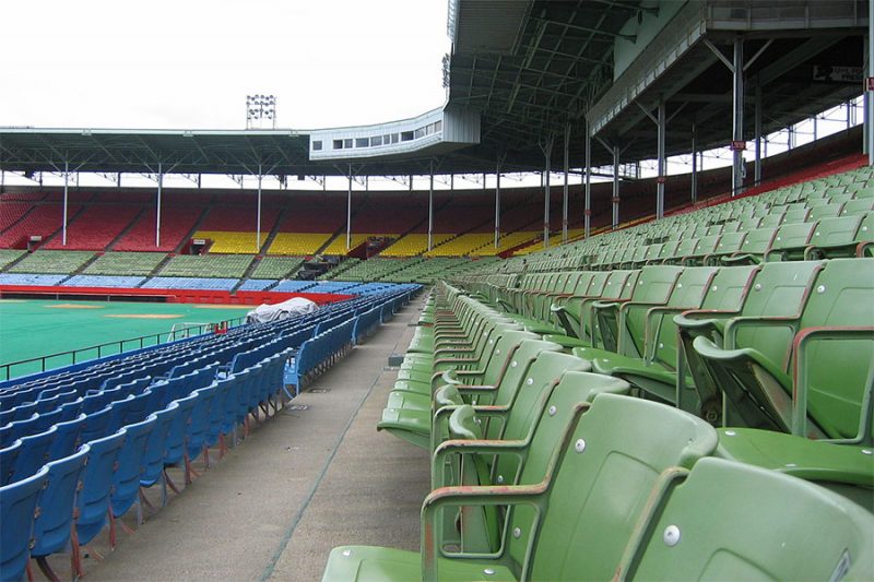 Colorful seats in the grandstand section of Old Cardinal Stadium. (Courtesy Wikipedia)