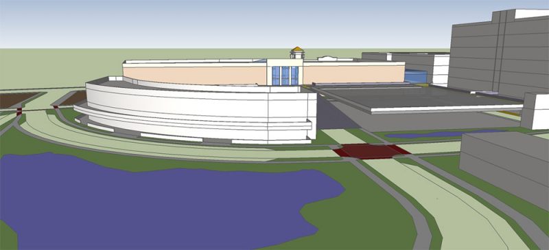 View of the Walmart Site from the south. Curved retail and restaurant building, parking structure, lake, two-story Walmart, and surrounding structures shown. (Courtesy Urban Composition)