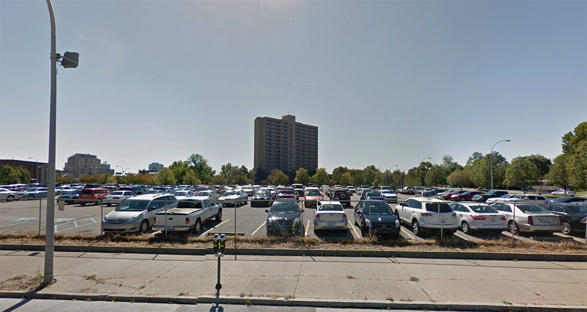LMHA is spending $150,000 to repave a parking lot at Avenue Plaza, the high rise pictured, located in a part of Downtown replete with parking lots. (Courtesy Google)