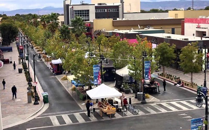 Creating walkable development is a key finding. This award-winning example from Lancaster, California, shows a six-lane street reduced to three with a tree-lined central public space. (Courtesy EPA)