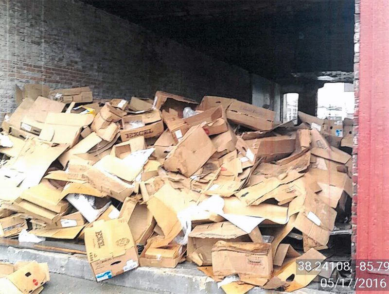 Several violations were issued for leaving large amounts of debris, like these cardboard boxes, around the property. (Courtesy Metro Louisville)
