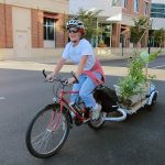 Amanda Fuller transports a park-ful of plants by bike. (Mary Beth Brown)