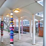 A photo montage showing an example of what a yarn-bombed plaza might look like. (Branden Klayko)