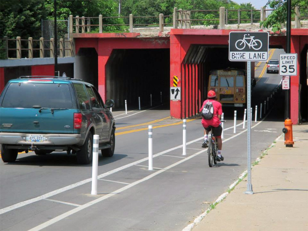 A buffered bike lane with bollards on Fourth Street near the University of Louisville. (Courtesy Bike Louisville)