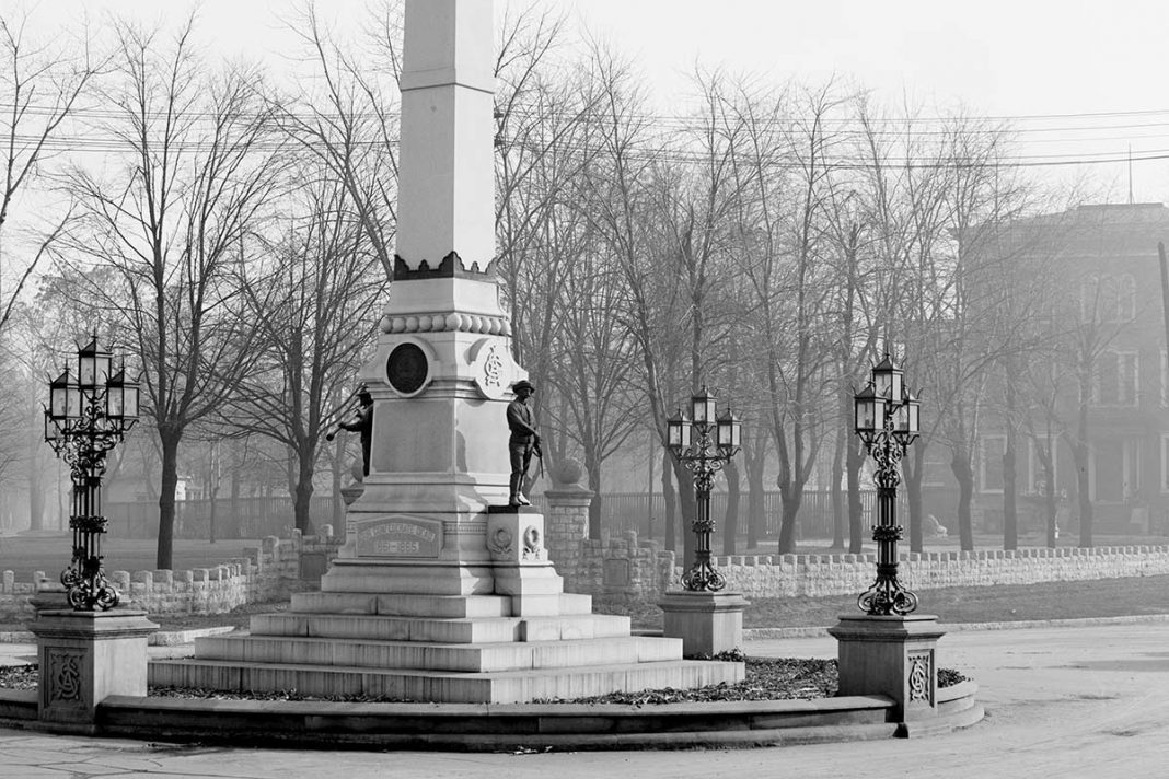 The Confederate Monument showing a prominent base with lamps. (Library of Congress)
