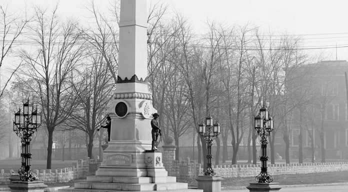 The Confederate Monument showing a prominent base with lamps. (Library of Congress)